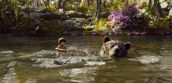 Neel Sethi is Mowgli and Bill Murray is Baloo in The Jungle Book